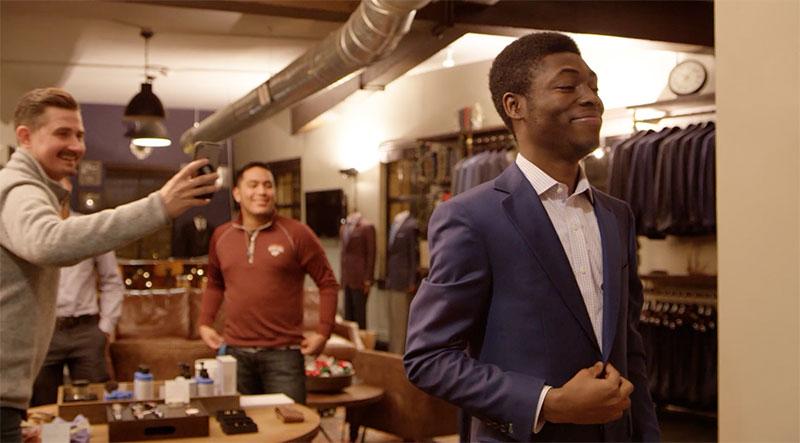 Mavo Hemenoo, a student at Bryant Alternative High School, tries on his suit